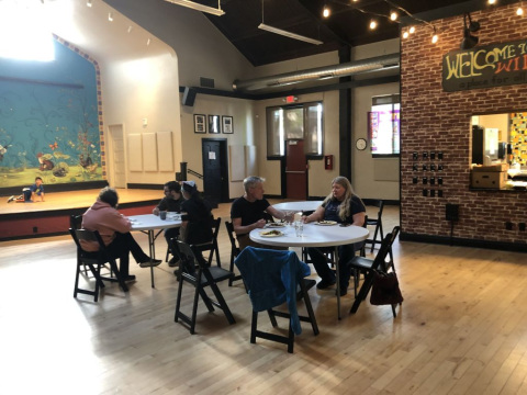 People sitting at a table in Wil-Mar Neighborhood Center